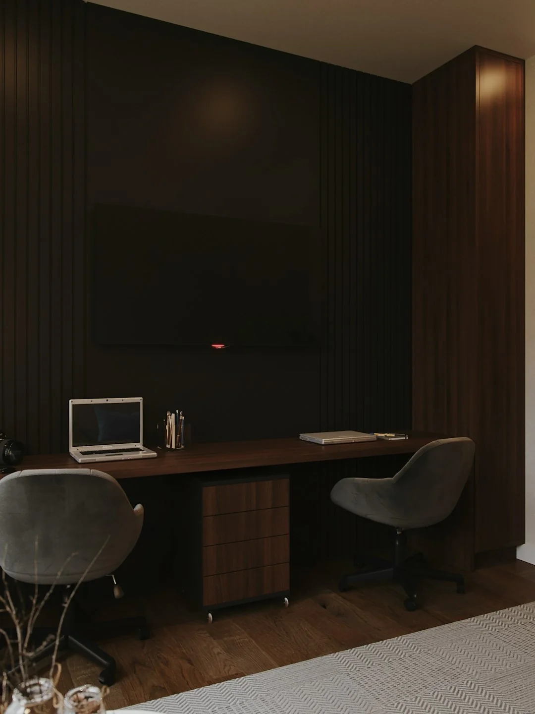 A contemporary workspace showcasing a laptop, tablet, and smartphones, ideal for tech and freelance use.